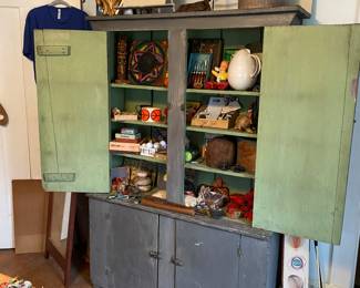 Grand gray antique cupboard with multiple swing doors shelving 