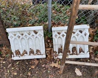 Architecture pieces line the perimeter of the back yard 
