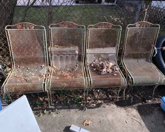 Green metal yard chairs 