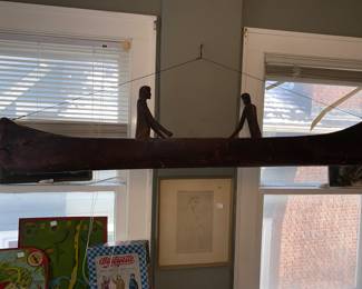 Wooden folk art long boat with 2 carved figures 