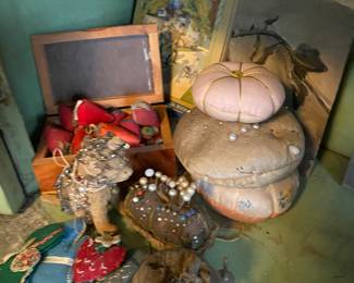 Pin cushions and strawberry needle sharpeners