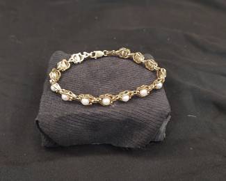 14k gold and pearl tennis bracelet.