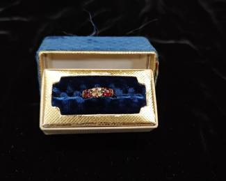 14-18k gold ring with 4 diamond and 2 ruby settings.