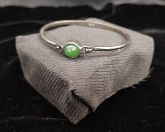 Sterling silver and jade stone bracelet.