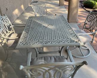 Patio table with four chairs. Two swivel chairs