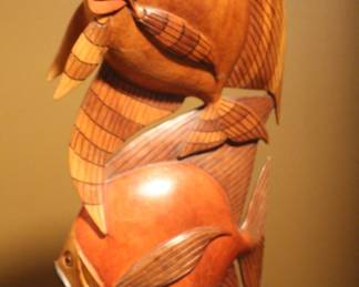 Carved wooden fish sculpture.