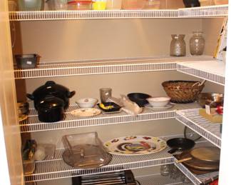Pantry has lots of cookware, storage and more.