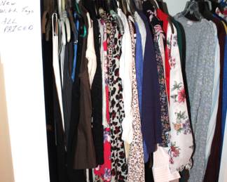 ALL the clothing in this closet is new with tags.
