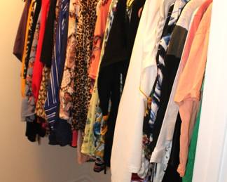 Large amount of woman's clothing.  Sizes from medium to extra large.