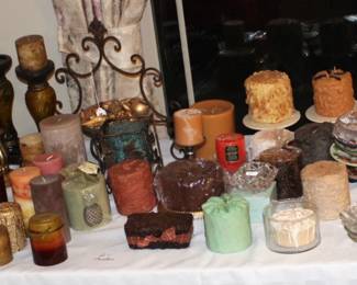 Large amount of candles and candle items.