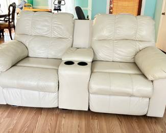 Leather loveseat with electric recliners, cup holders and center console 