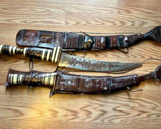 Arabian swords in leather pouches 