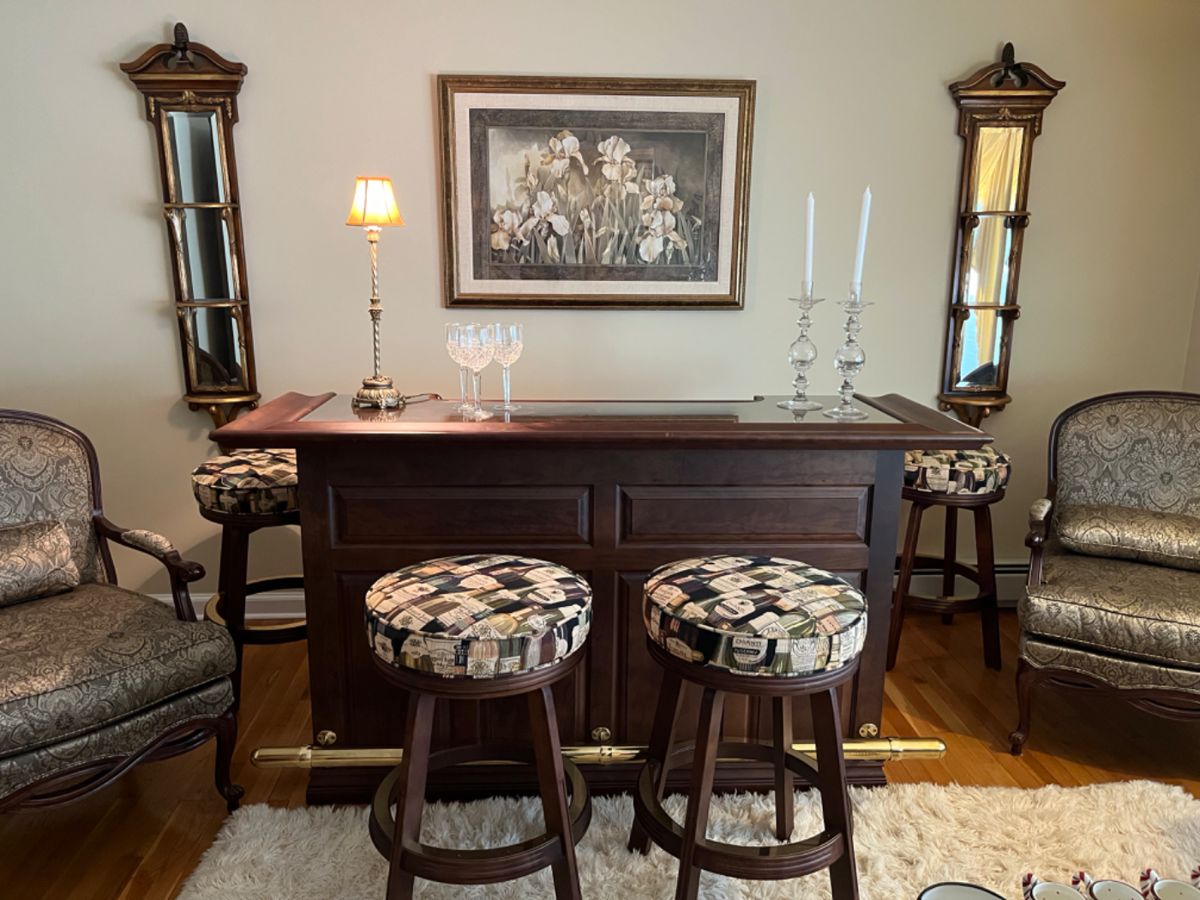 Glass topped bar with brass rail, locking liquor storage