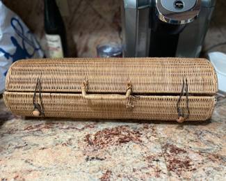 Vintage barbeque equipment in round wicker basket