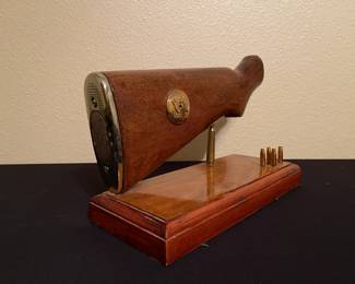M-1 Garand long gun buttstock cut off at wrist for display. Also includes ammo in display.