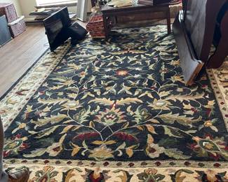 Blue, burgundy, green and tan area rug