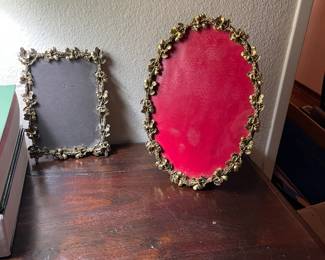 Vintage gold and silver filigree picture frames.