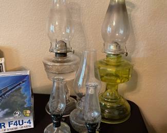 Five vintage hurricane lamps.