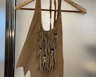 Suede halter top with fringe.