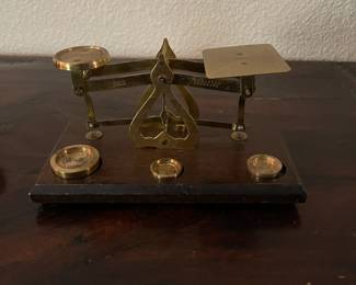 Vintage brass and wood postal scale with weights. 