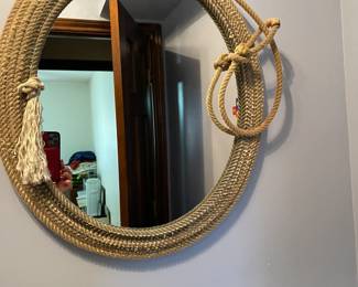 Lasso/ rope themed wall mirror.