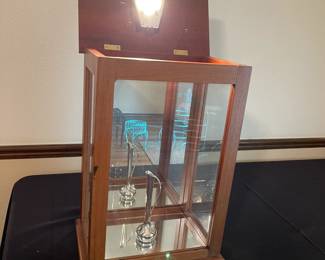 Vintage hand-made lighted display cabinet with mirrors on sides and bottom. 