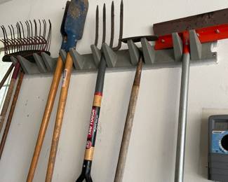 Rakes, post hole diggers, pitchfork, hoe and other garden tools