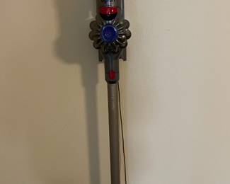 Dyson stick vacuum and wall attachment