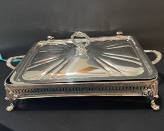 Large silver plate casserole dish with hinged lid and Hagerty blue zipper bag.