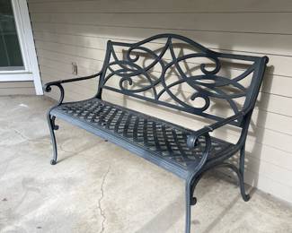 Metal bench that seats two comfortably, three if you like each other ;) 