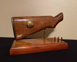 M-1 Garand long gun buttstock cut off at wrist for display. Also includes ammo in display.