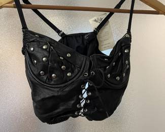 Leather lace-up bustier with grommet and brad detailing.