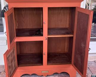 Coral colored storage cabinet