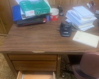 sturdy and spacious office desk. This desk provides ample workspace and storage, making it perfect for anyone working from home or in need of a dedicated work area. 