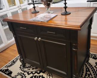 Island base cabinet (42" x 26" in rubbed black with two drawers and two doors for storage.  Countertop Grothouse Sapele Mahogany distressed Durata Edge Roman ogee