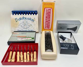New In Box Vintage Corn Skewers, Table Sweeper, Royal Copenhagen Wine Stopper & Balabustas Recipe Book
Lot #: 121