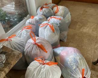 These are bags of clothes that will be sold by the bagful.  Very cheap.