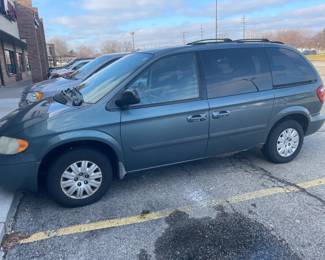 . . . this van is a 2006 Town and Country that has about 145,000 miles on it and some rust -- great transportation or delivery vehicle -- runs fine