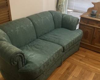Green sofa, antique washstand