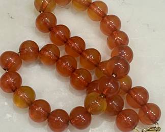1960s natural Baltic amber beads on a 14k gold rope chain.  Large choker.