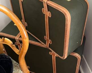 Custom $3000 hard case luggage in dark green and tan leather