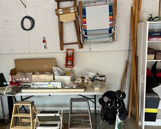 Golf bag, oar, fishing poles, scrap wood