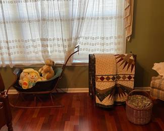 Handmade quilts; antique child’s sled