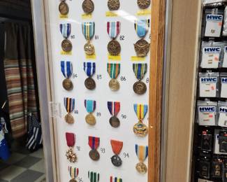 Large Assortment of Military Medals in Display Case
