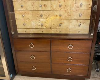 Lexington rare unusual chest Mahogany with tiger maple veneered drawers - 10 top drawers including two skinny (one with fitted felt for jewelry or watches) on 6 large drawers. Chest stamped Lexington. Cabinet light up between glass and top drawers,  50Wx60Tx21W. Mint condition. $2100. Lexington furniture is owned by Lexington Home Brands. It’s one of the top furniture brands in the world, and its pieces have become known for its high-quality design and unique aesthetic.

When you shop from Lexington, NC, you’ll have access to a well-rounded collection of furniture designed to suit anyone’s tastes. Their furniture isn’t cheap, but you can rest easy knowing it’ll last for years and years after you buy it.

