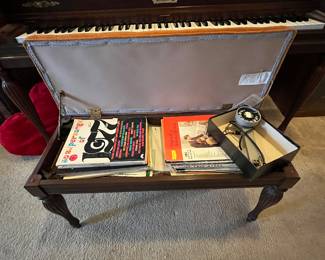 Piano bench and music books