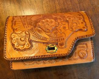 Tooled leather purse with fur lining....