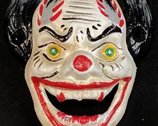 CAST IRON DEVIL CLOWN BOTTLE