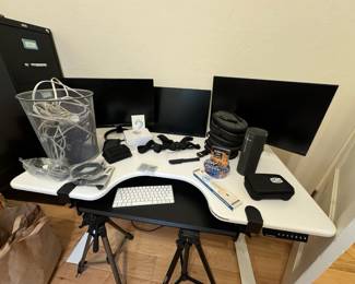 Assortment of Office Supplies and Keyboards, Sleek Black/White Desk