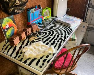 Thick glass top for a desk with a thumb print